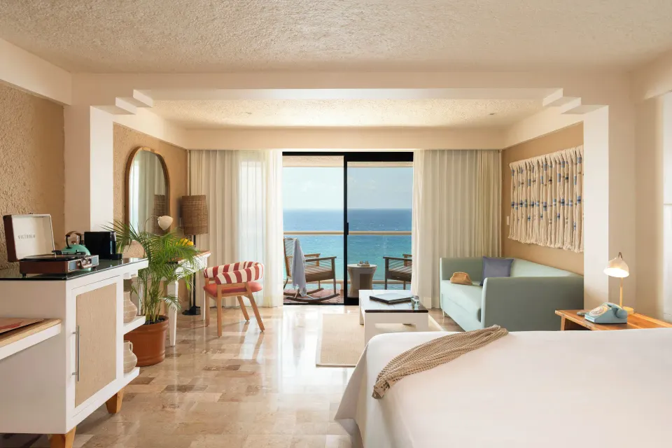 ZEL House Ocean Front guest room with king bed and balcony overlooking the ocean at Melia Cozumel
