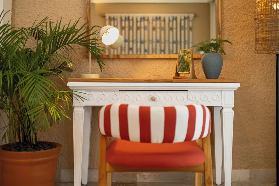 ZEL Room Ocean View dressing table with striped stool and mirror at Melia Cozumel