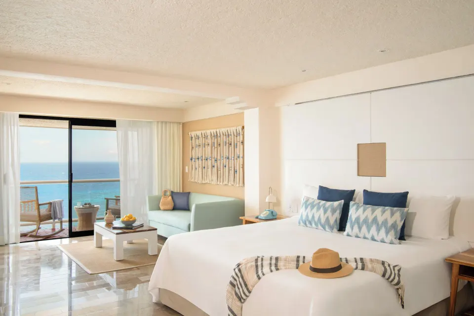 ZEL Room Ocean View with king bed, sofa and balcony at Melia Cozumel