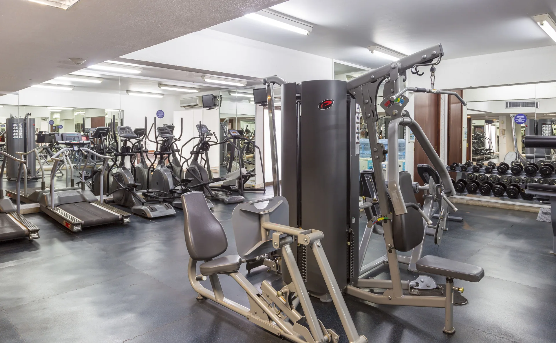 Fitness room with treadmills, ellipticals, weights and strength machines at Melia Puerto Vallarta.