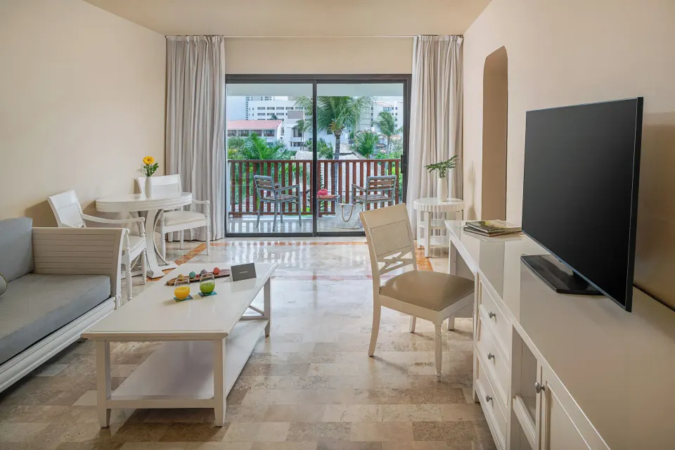 Junior Suite Ocean View living area with balcony at Melia Puerto Vallarta.