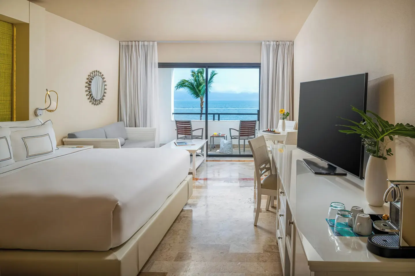 Premium Ocean Front room with king bed, balcony, and ocean view at Melia Puerto Vallarta.