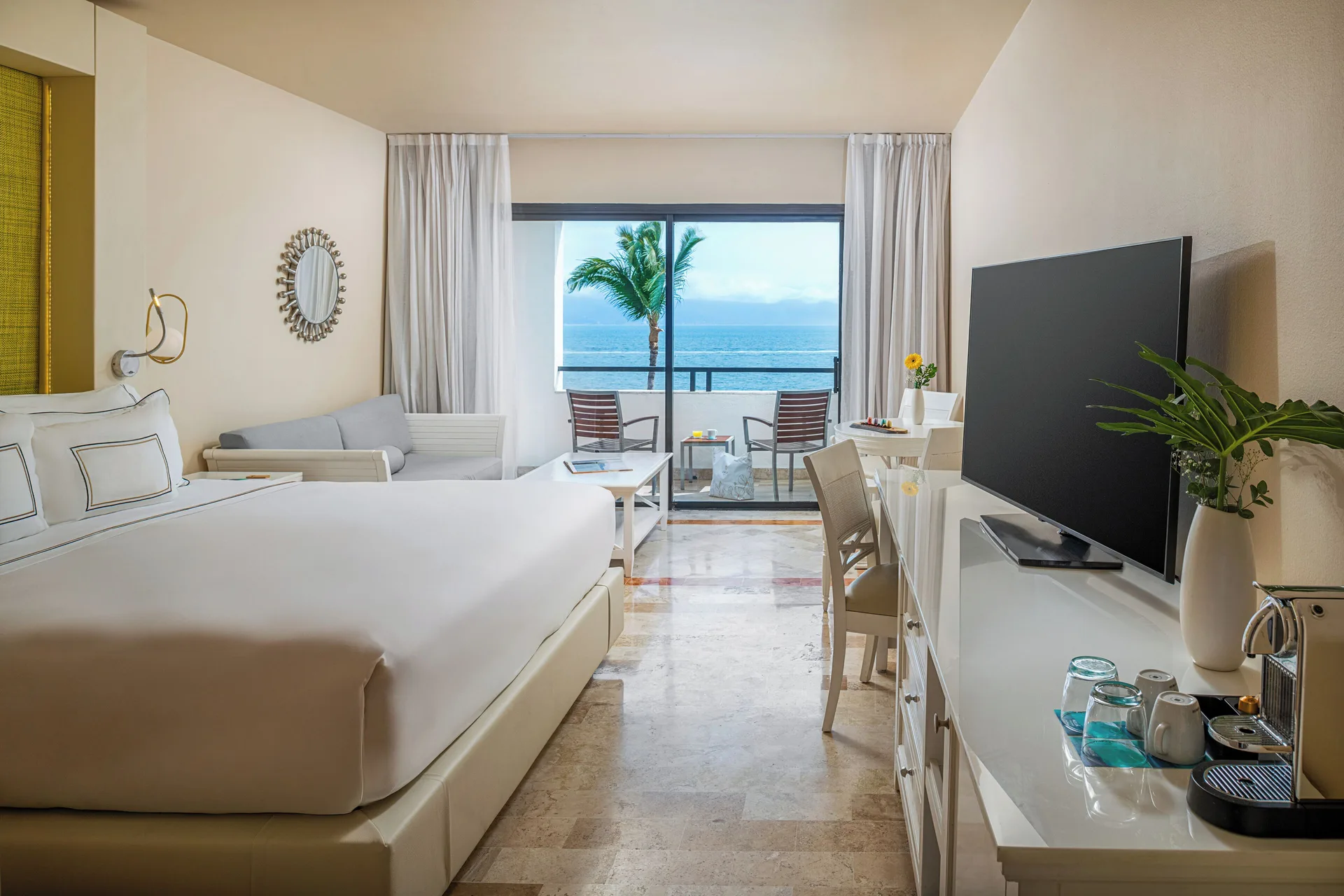 Premium Ocean Front room with king bed, balcony, and ocean view at Melia Puerto Vallarta.
