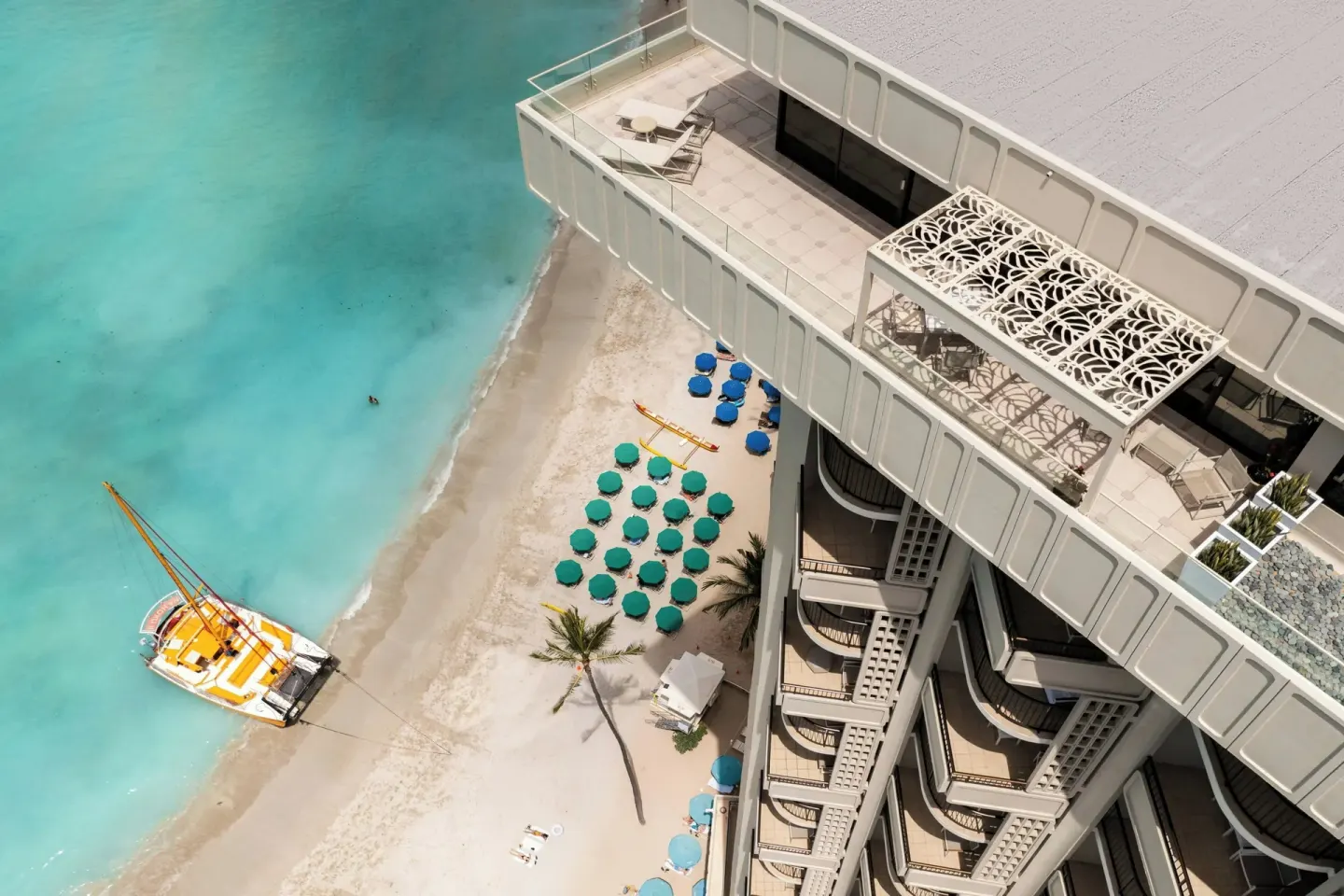 Aerial beach and balcony view at Moana Surfrider, A Westin Resort & Spa.