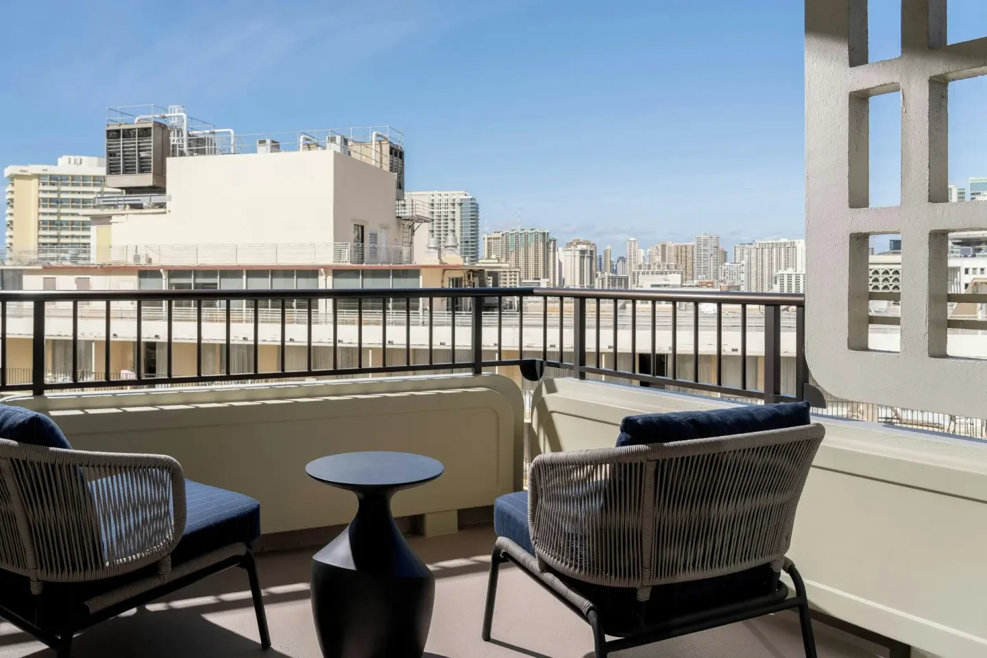 Balcony with city skyline view at Moana Surfrider, A Westin Resort & Spa.