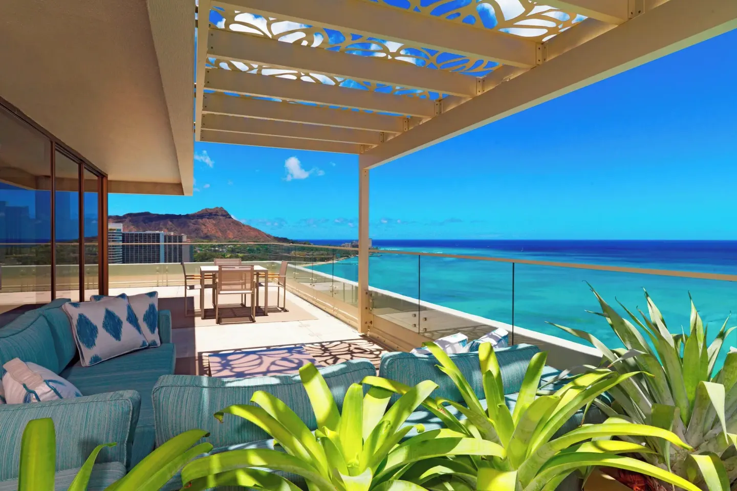 Large balcony lounge with ocean and Diamond Head views at Moana Surfrider, A Westin Resort & Spa.