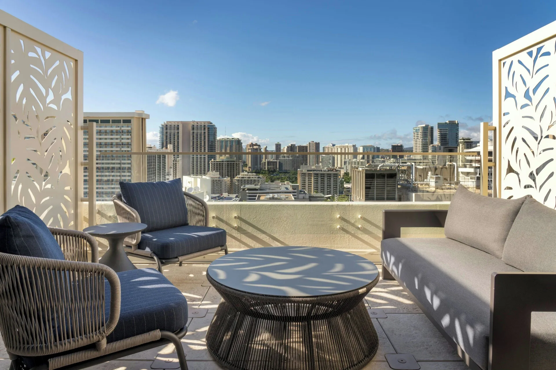 City-view terrace with lounge seating at Moana Surfrider, A Westin Resort & Spa.
