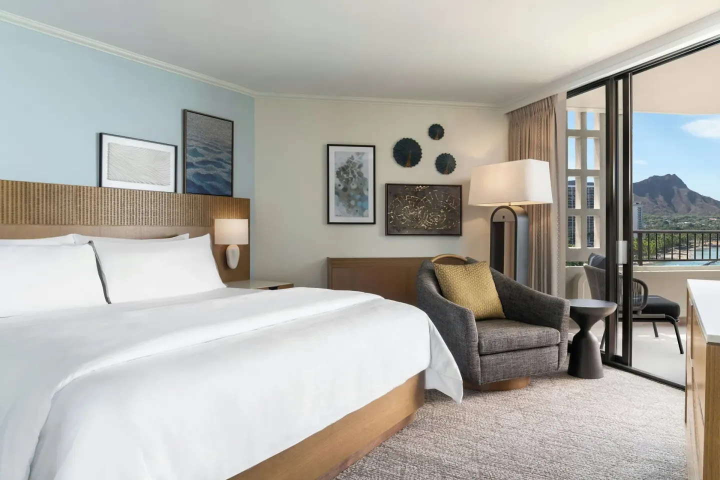 King bed guest room with balcony and Diamond Head view at Moana Surfrider, A Westin Resort & Spa.