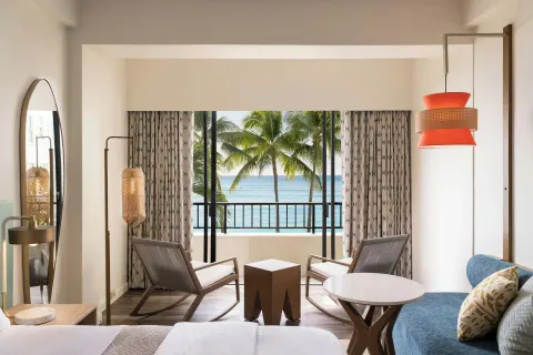 Ocean-view guest room seating area at Moana Surfrider, A Westin Resort & Spa.