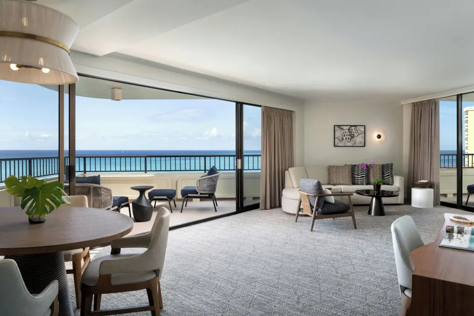 Ocean-view suite living area with lanai seating at Moana Surfrider, A Westin Resort & Spa.