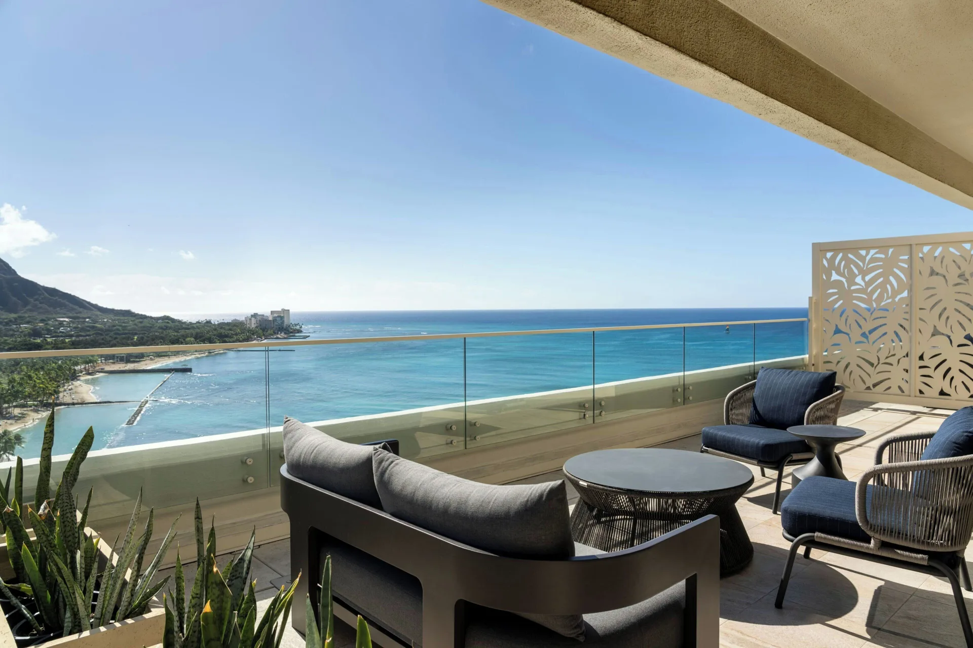 Oceanfront lanai seating with Diamond Head view at Moana Surfrider, A Westin Resort & Spa.