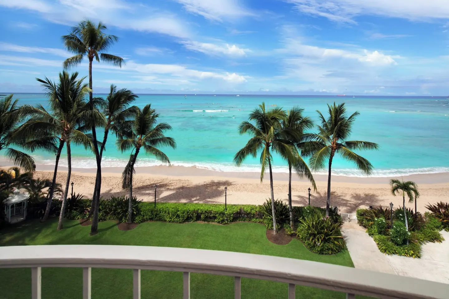 Palm-framed Waikiki Beach view from Moana Surfrider, A Westin Resort & Spa.