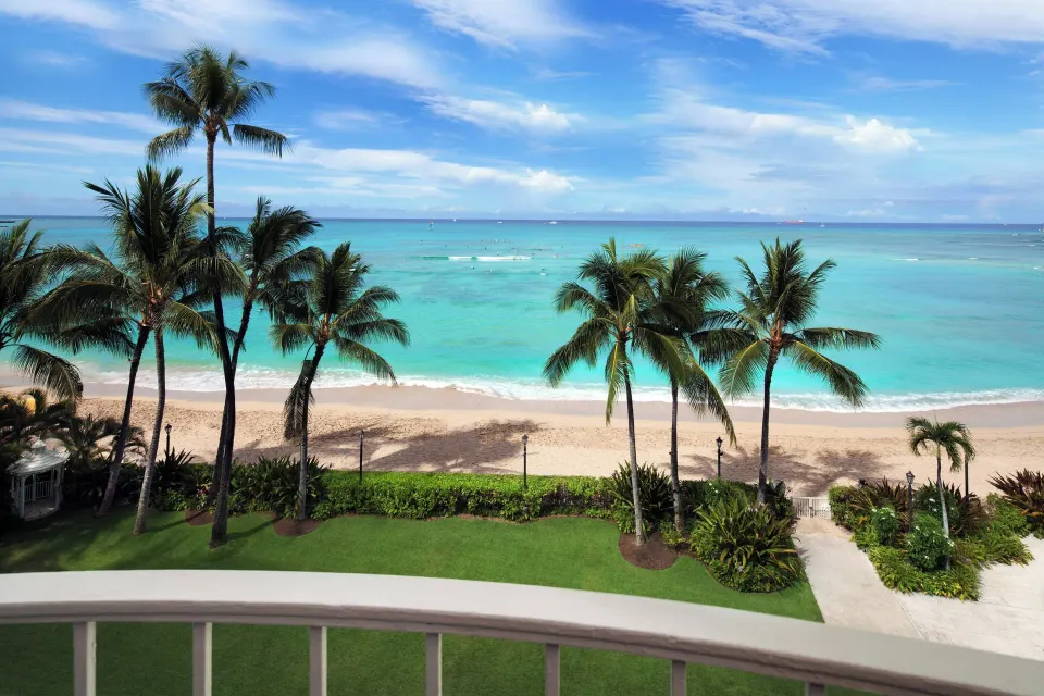 Palm-framed Waikiki Beach view from Moana Surfrider, A Westin Resort & Spa.