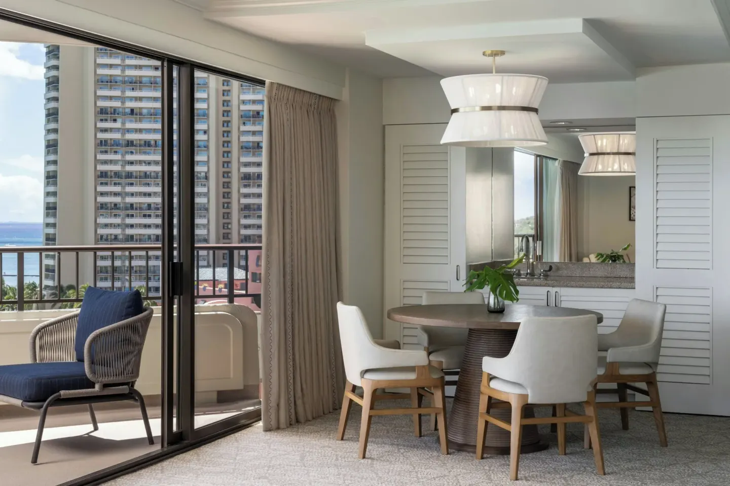 Suite dining area and balcony at Moana Surfrider, A Westin Resort & Spa.