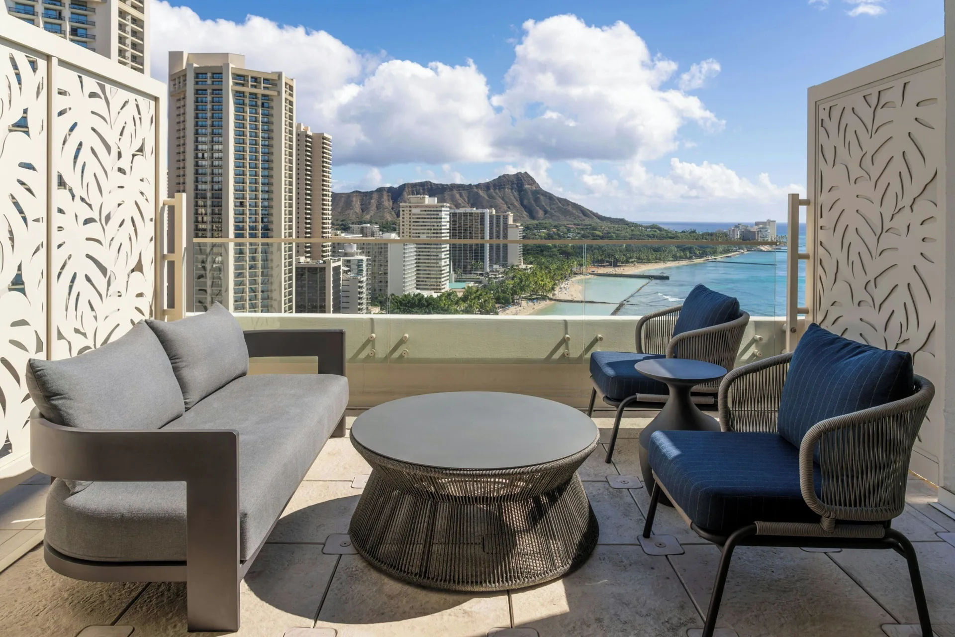 Terrace lounge seating with Diamond Head and ocean views at Moana Surfrider, A Westin Resort & Spa.