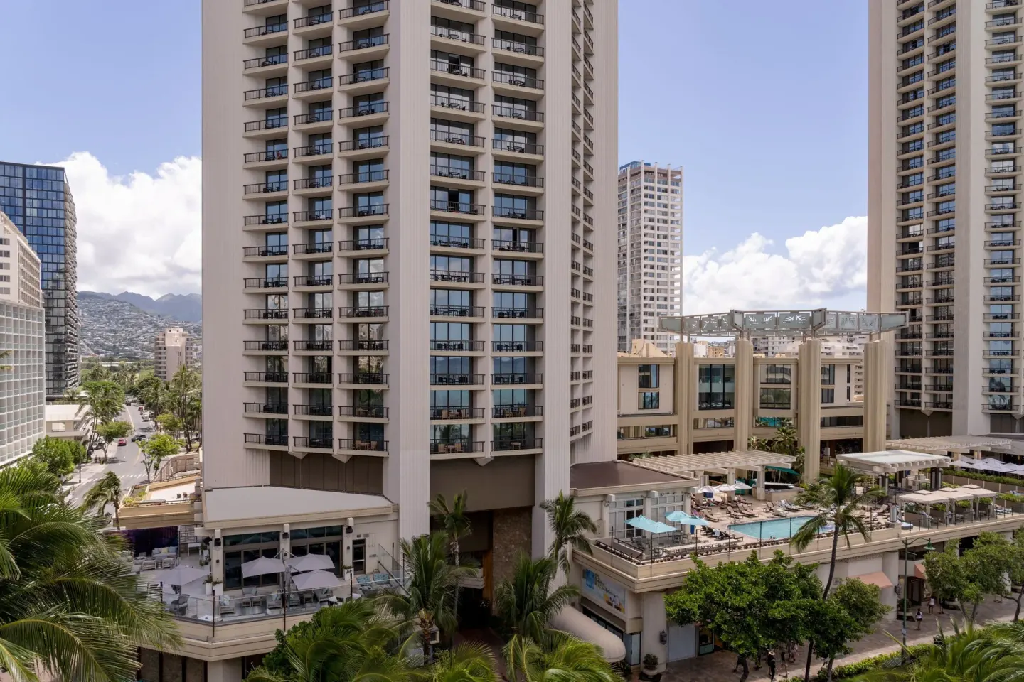 Exterior tower and pool deck at Moana Surfrider, A Westin Resort & Spa viewed from above.