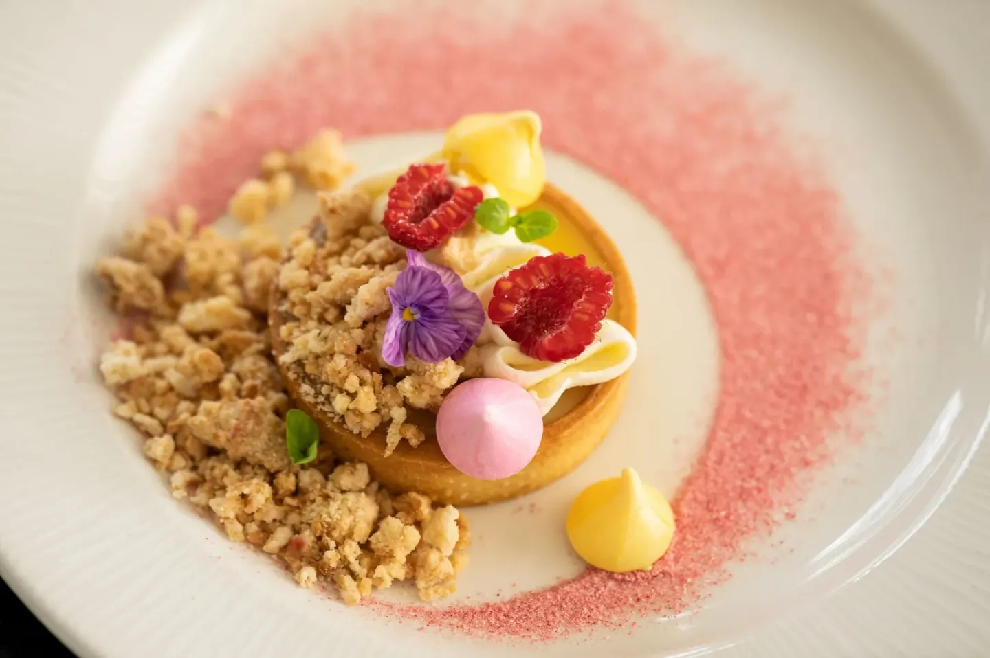 Plated fruit tart dessert at Moana Surfrider, A Westin Resort & Spa.