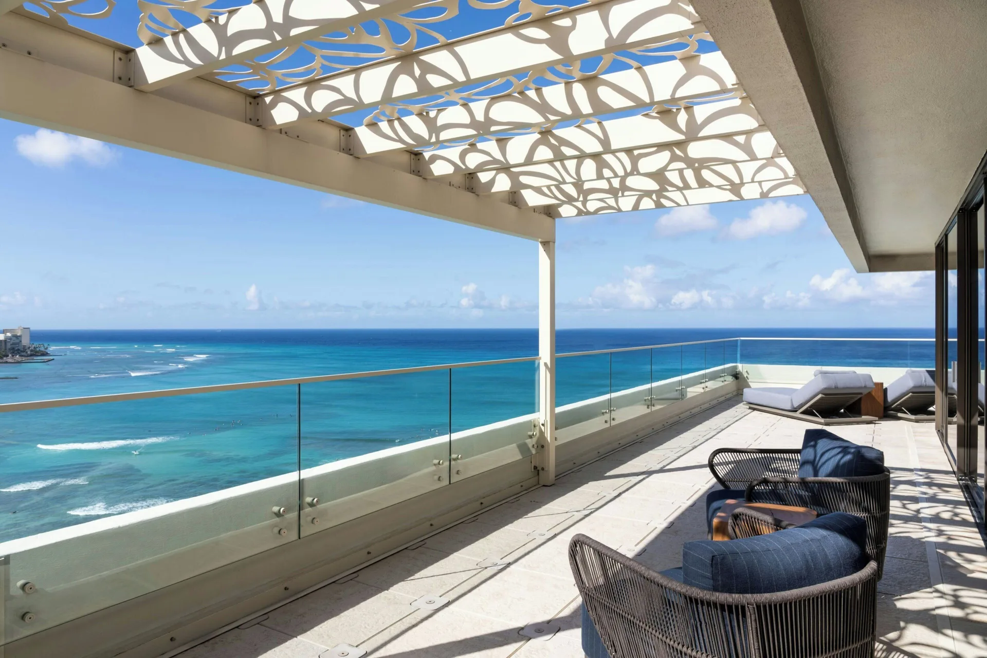 Penthouse Ocean Suite balcony at Moana Surfrider, A Westin Resort & Spa with lounge seating and sweeping ocean views.