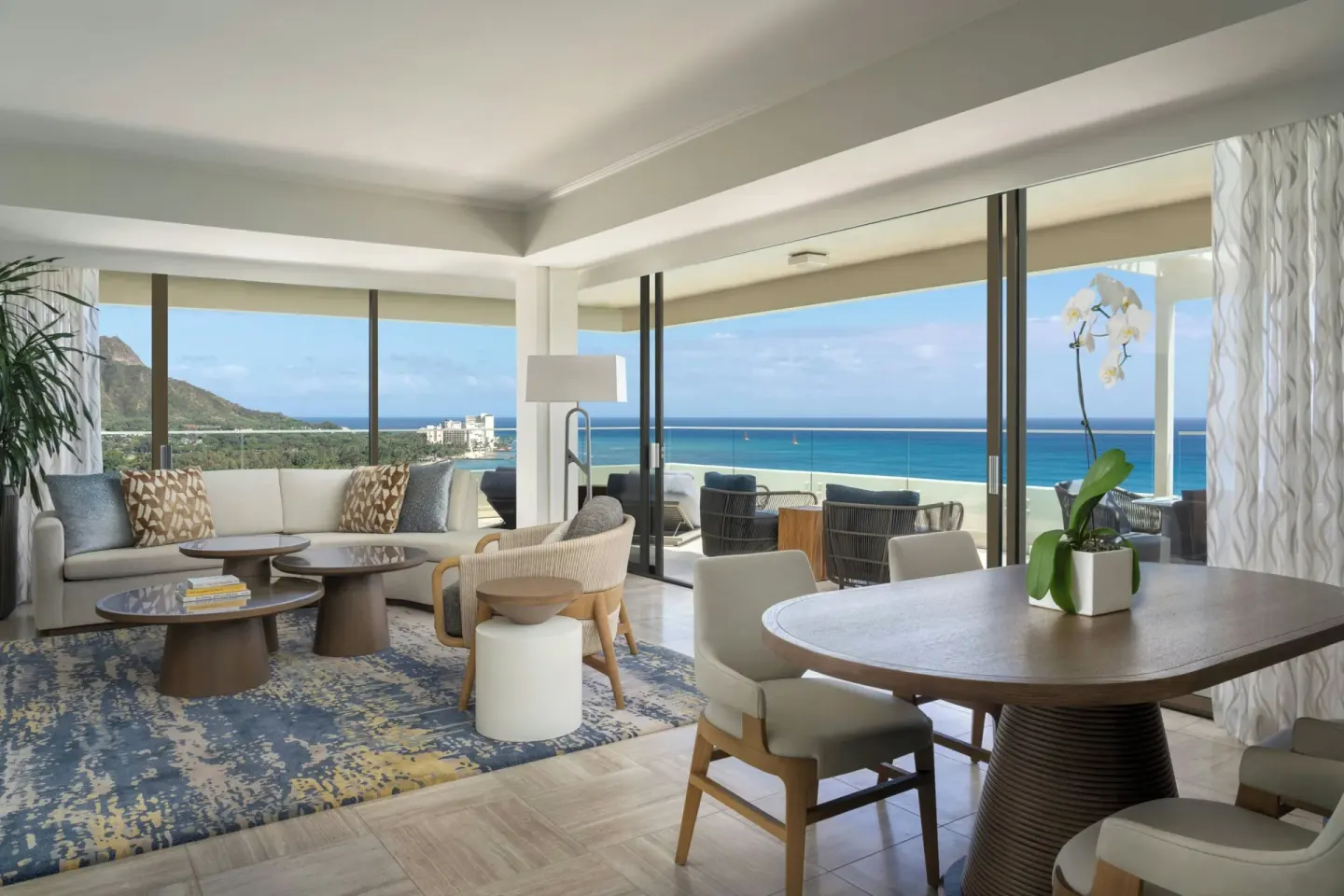 Penthouse Ocean Suite living and dining area at Moana Surfrider, A Westin Resort & Spa with balcony and ocean views.