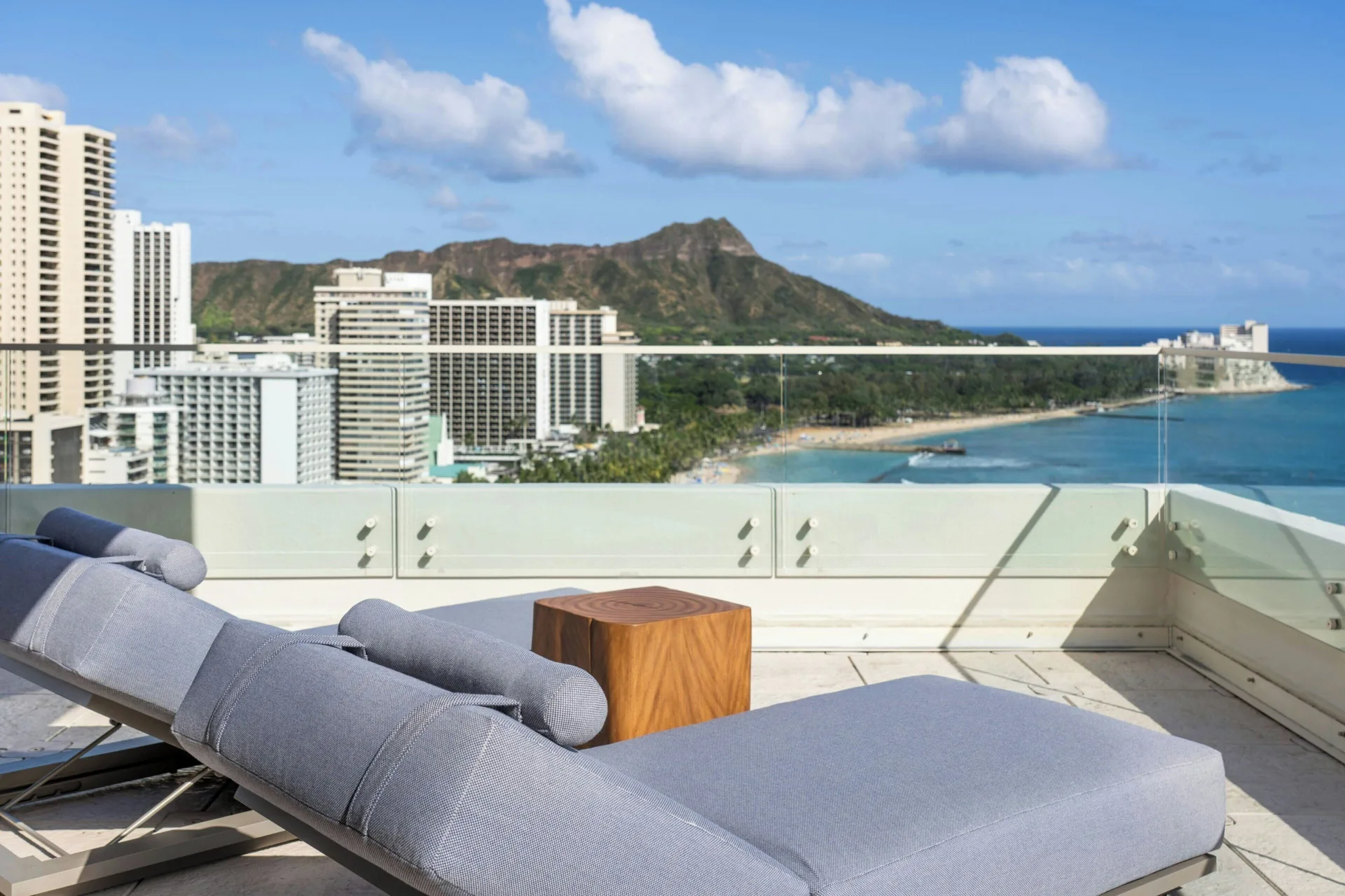 Penthouse Ocean Suite terrace lounger at Moana Surfrider, A Westin Resort & Spa overlooking Waikiki and Diamond Head.