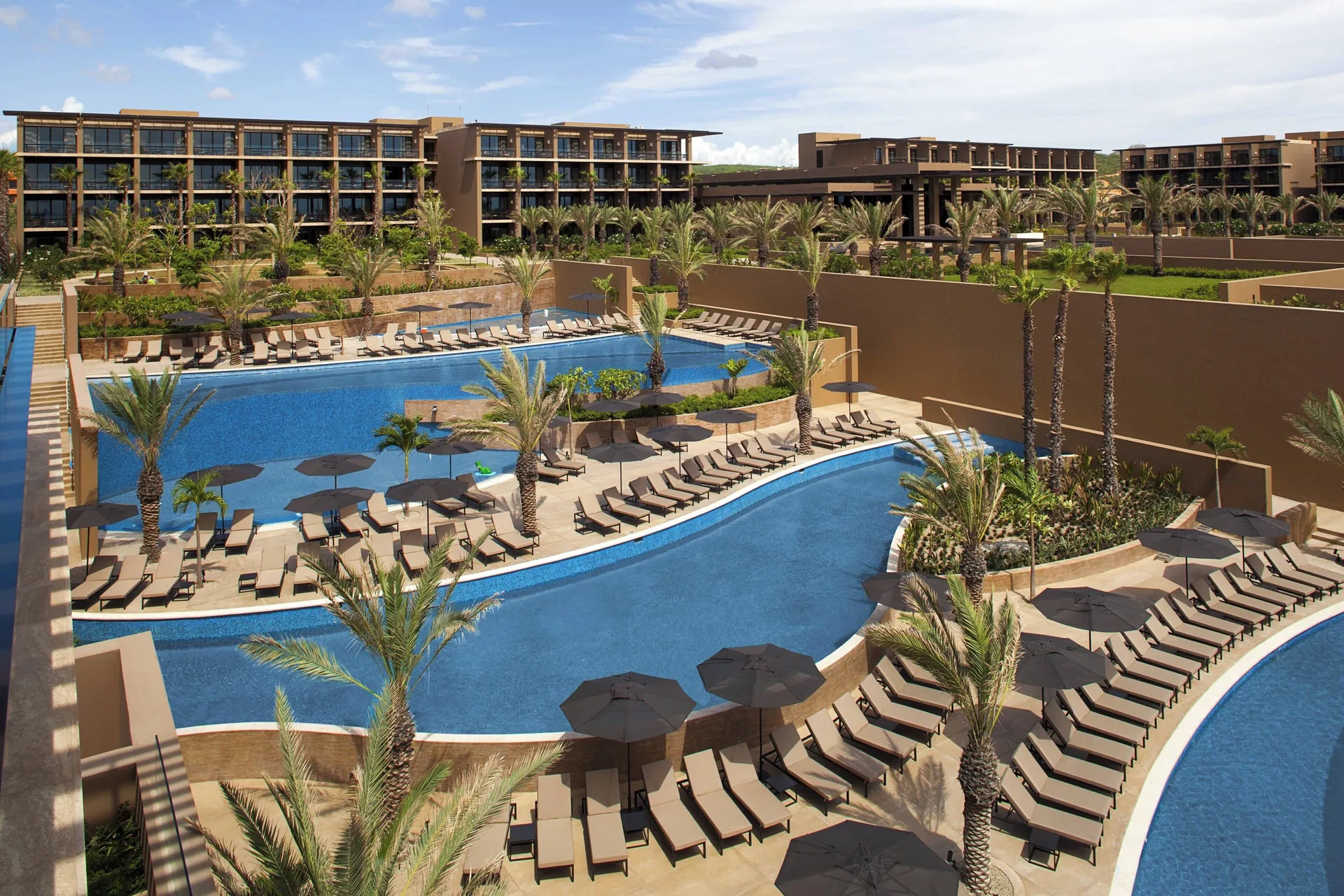 JW Marriott Los Cabos Beach Resort & Spa luxury beachfront property with modern architecture, infinity pools, and Sea of Cortez views.