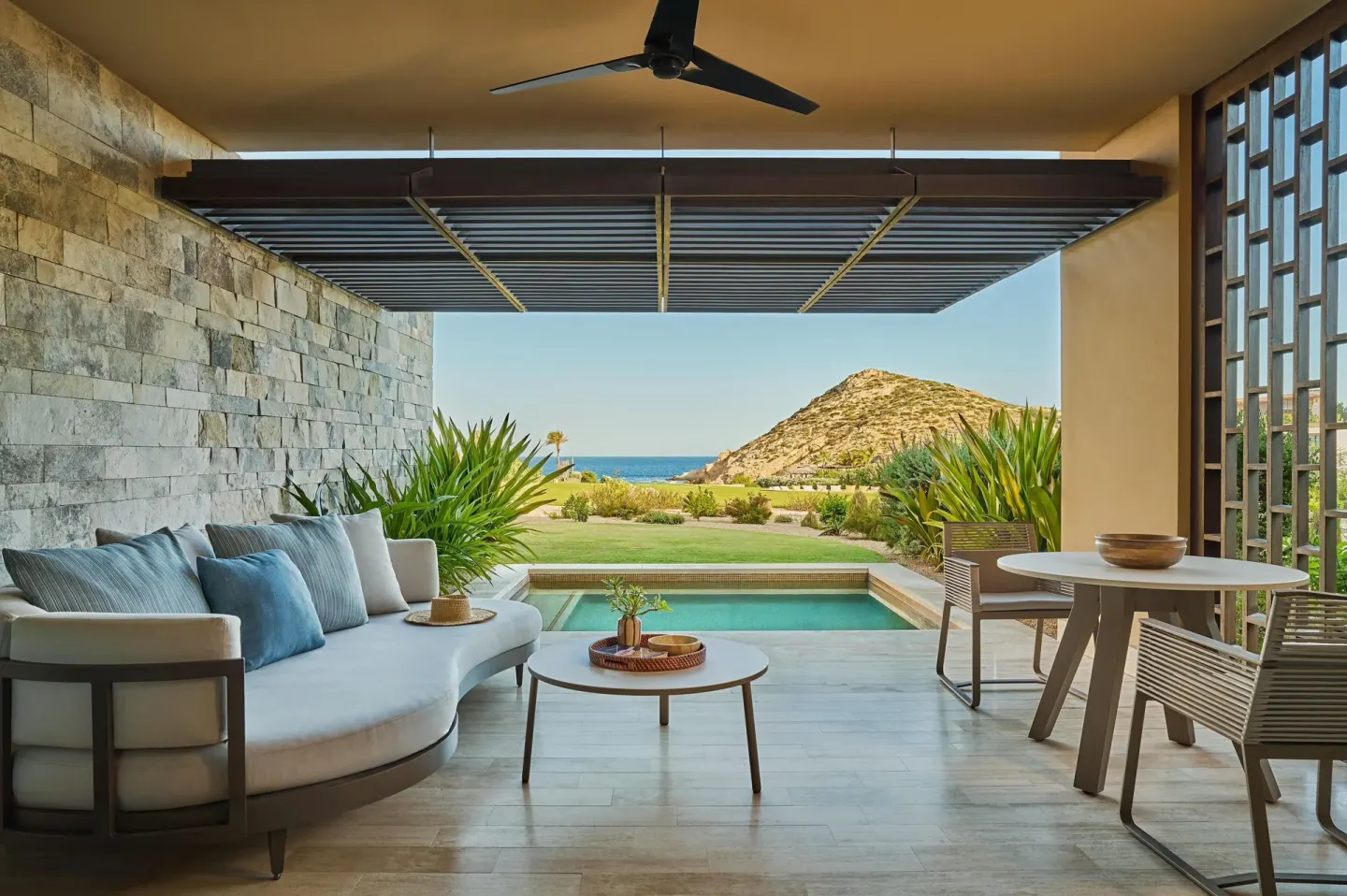 Covered terrace with plunge pool, seating, and ocean view at Montage Los Cabos.