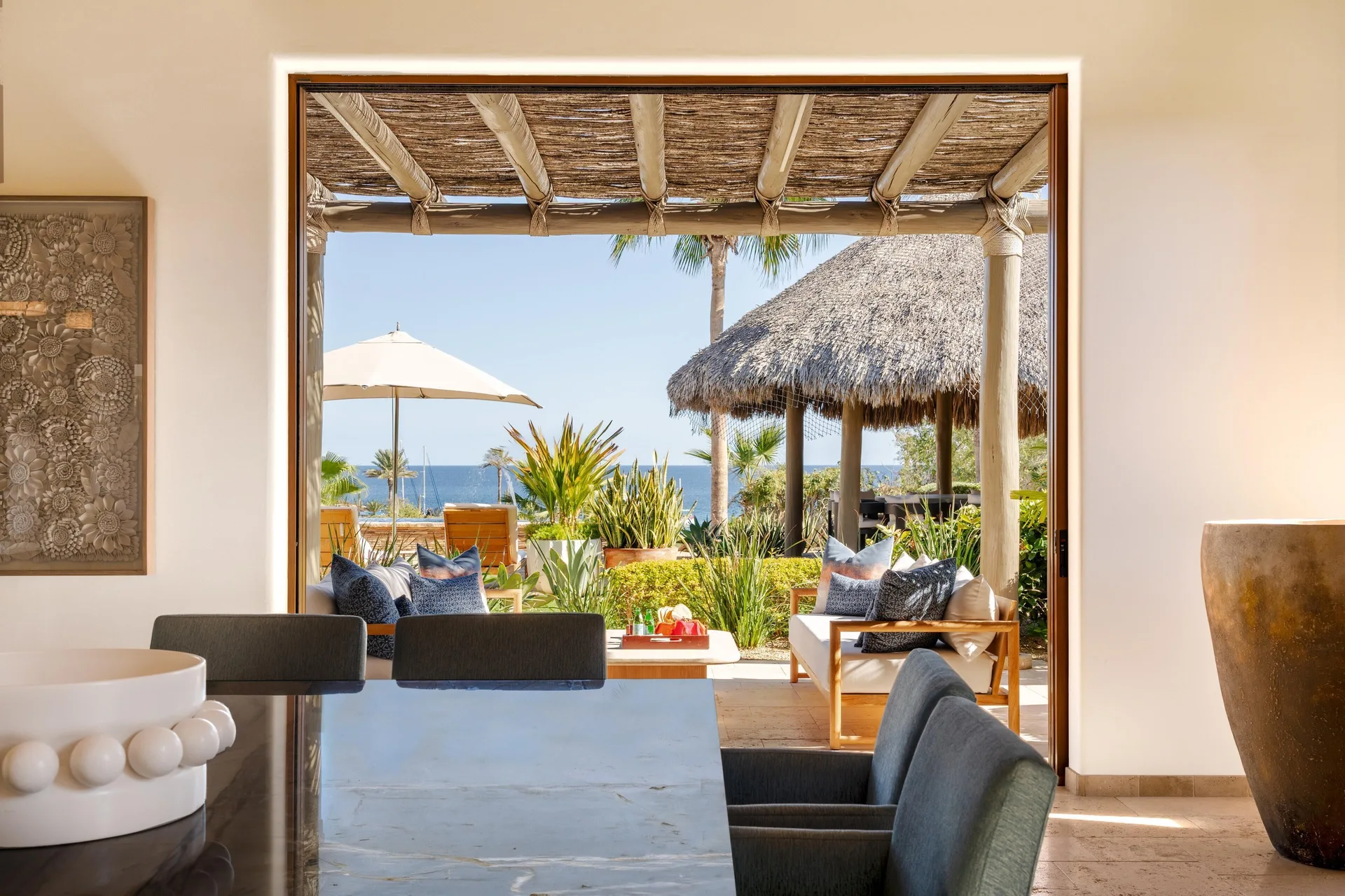 Dining area opening to a terrace with ocean glimpses at Montage Los Cabos.