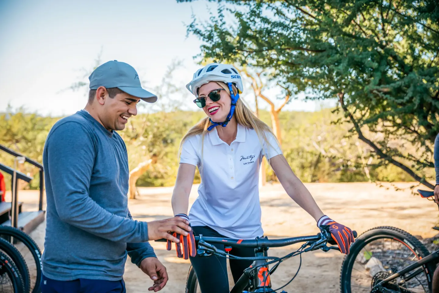 Guest with mountain bike and helmet on an outdoor trail near Montage Los Cabos.
