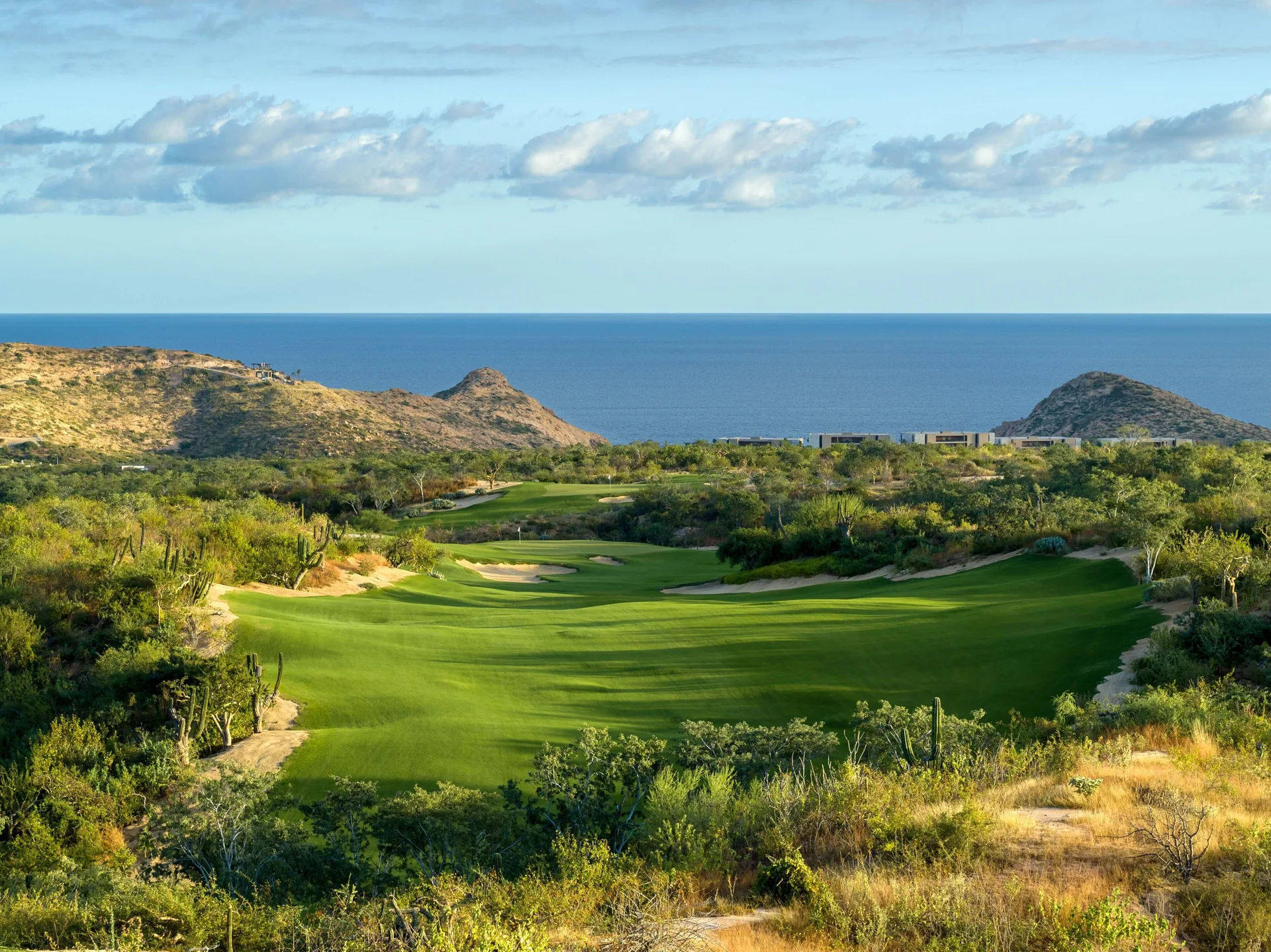 A green golf course overlooks the ocean near Montage Los Cabos.