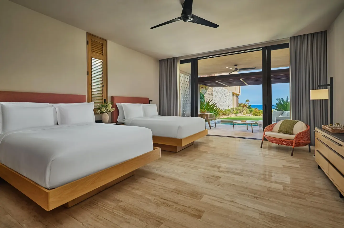 Two-bed guest room with terrace and ocean glimpse at Montage Los Cabos.