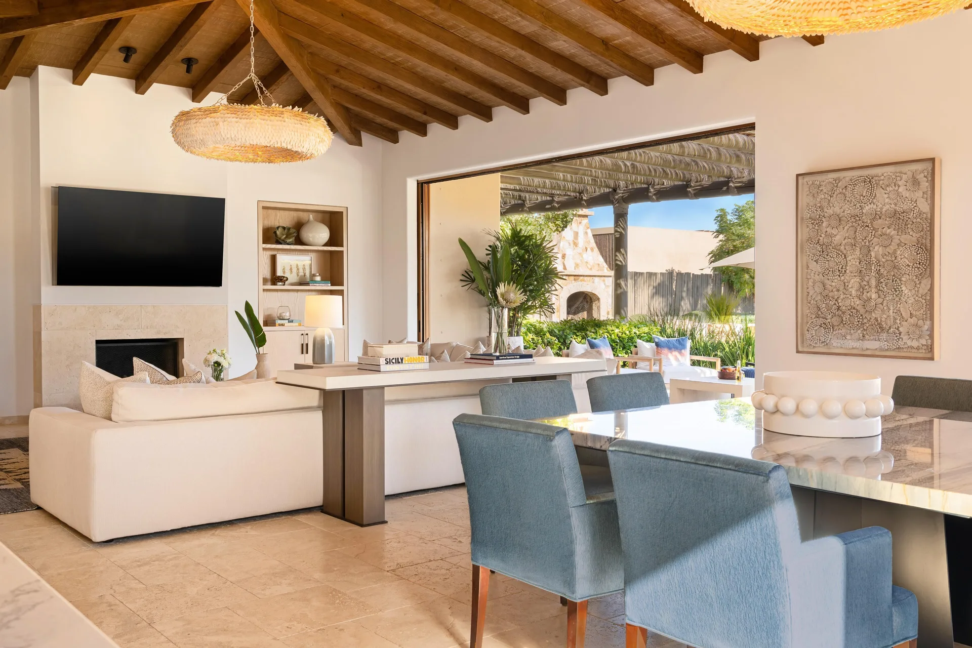 Open living and dining room with terrace seating at Montage Los Cabos.