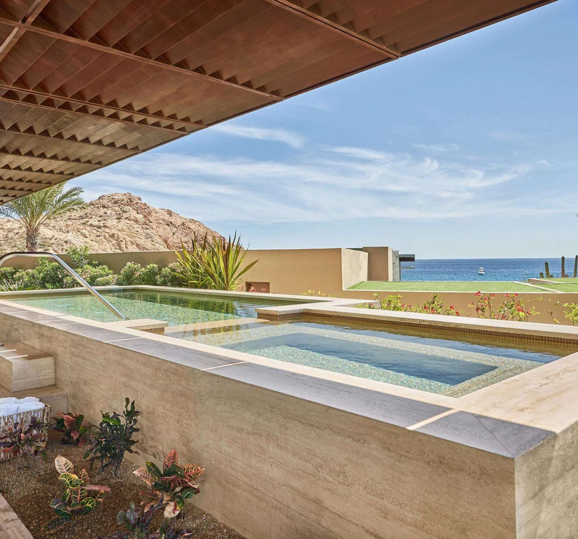 Private plunge pool on a covered terrace with ocean and hillside views at Montage Los Cabos.