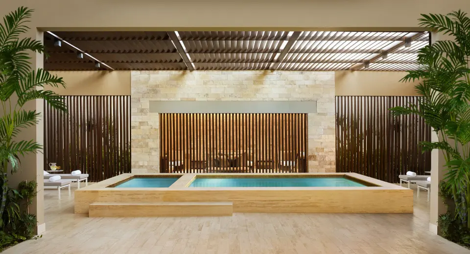 Indoor spa pool with lounge chairs and wood slat screens at Montage Los Cabos.