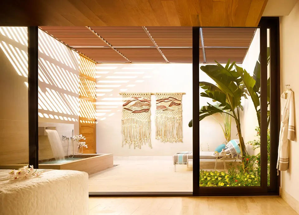 Spa treatment room with private courtyard and soaking tub at Montage Los Cabos.