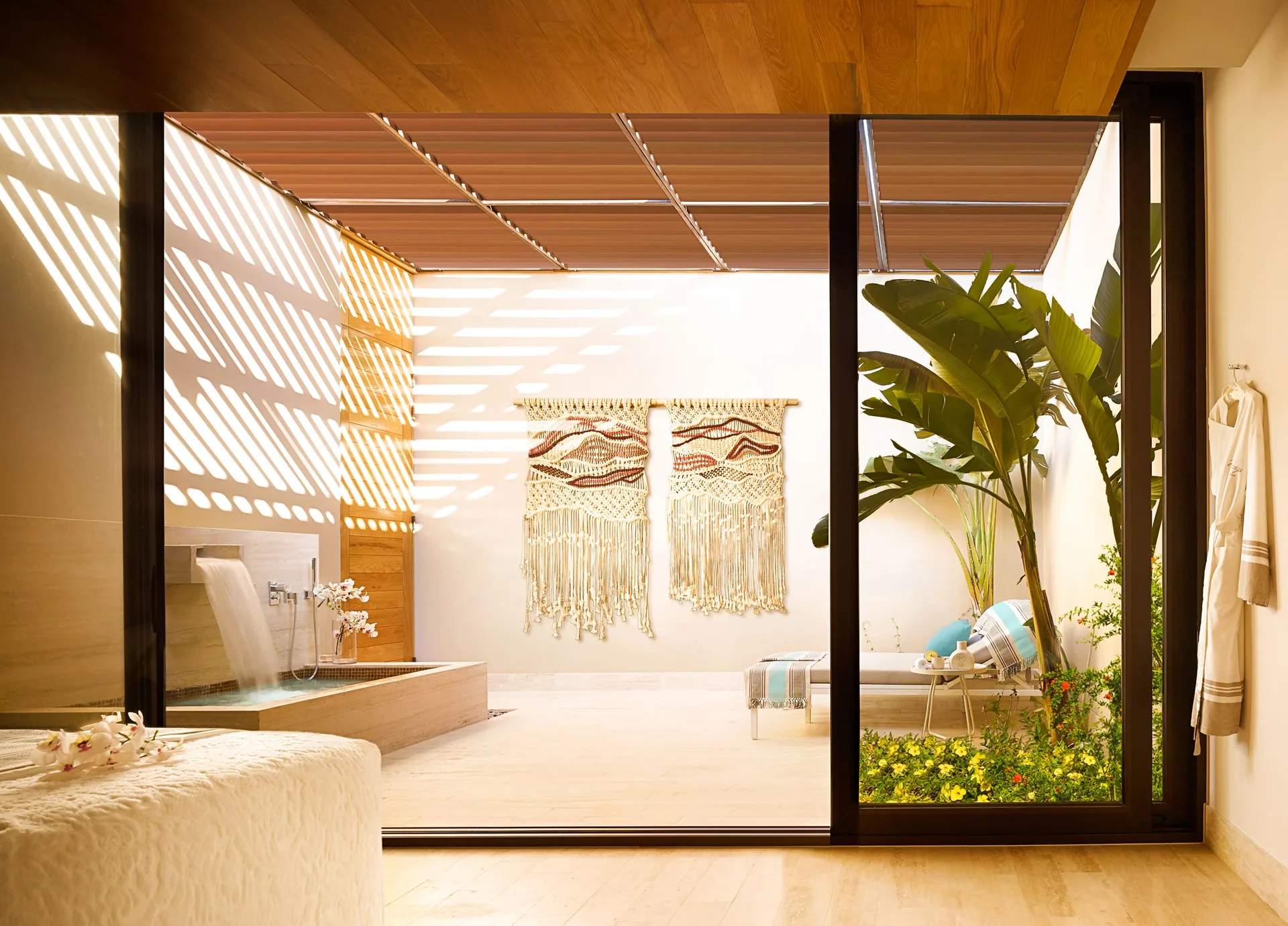Spa treatment room with private courtyard and soaking tub at Montage Los Cabos.