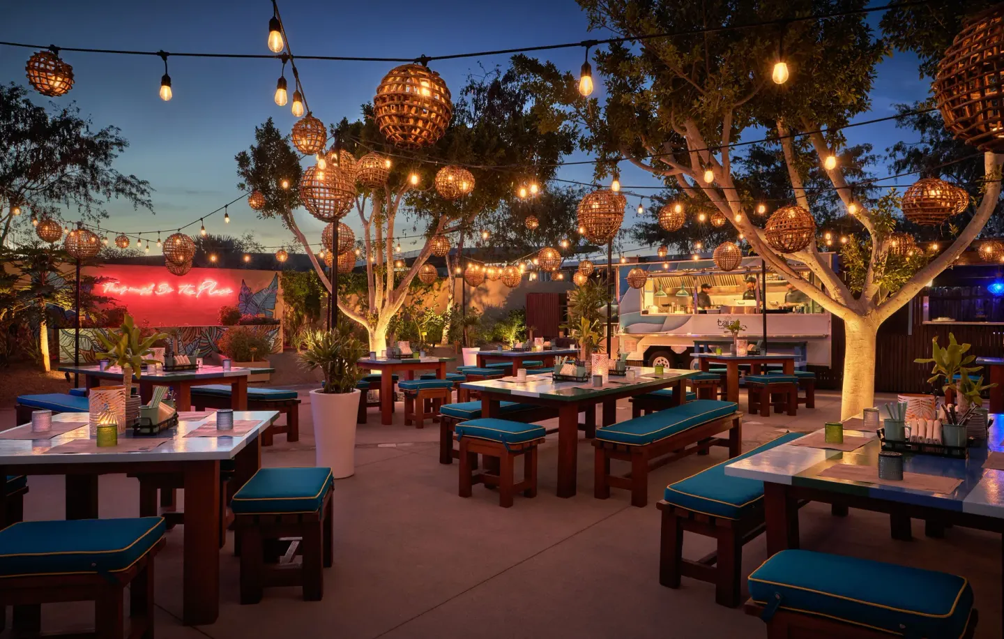 Outdoor Thai restaurant seating with lanterns and a food truck at Montage Los Cabos.