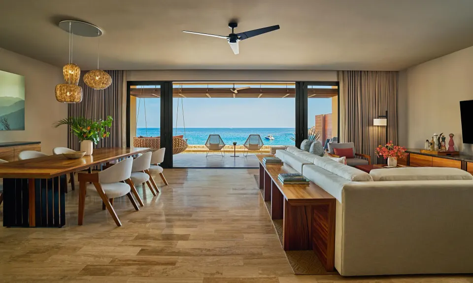 Open living and dining room with ocean view in a suite at Montage Los Cabos.