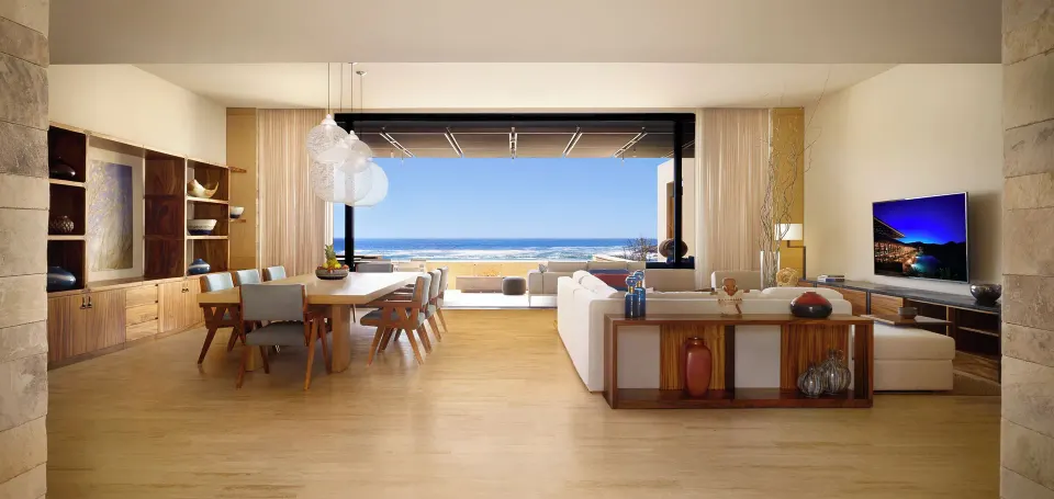 Open living and dining room facing the beach at Montage Los Cabos.