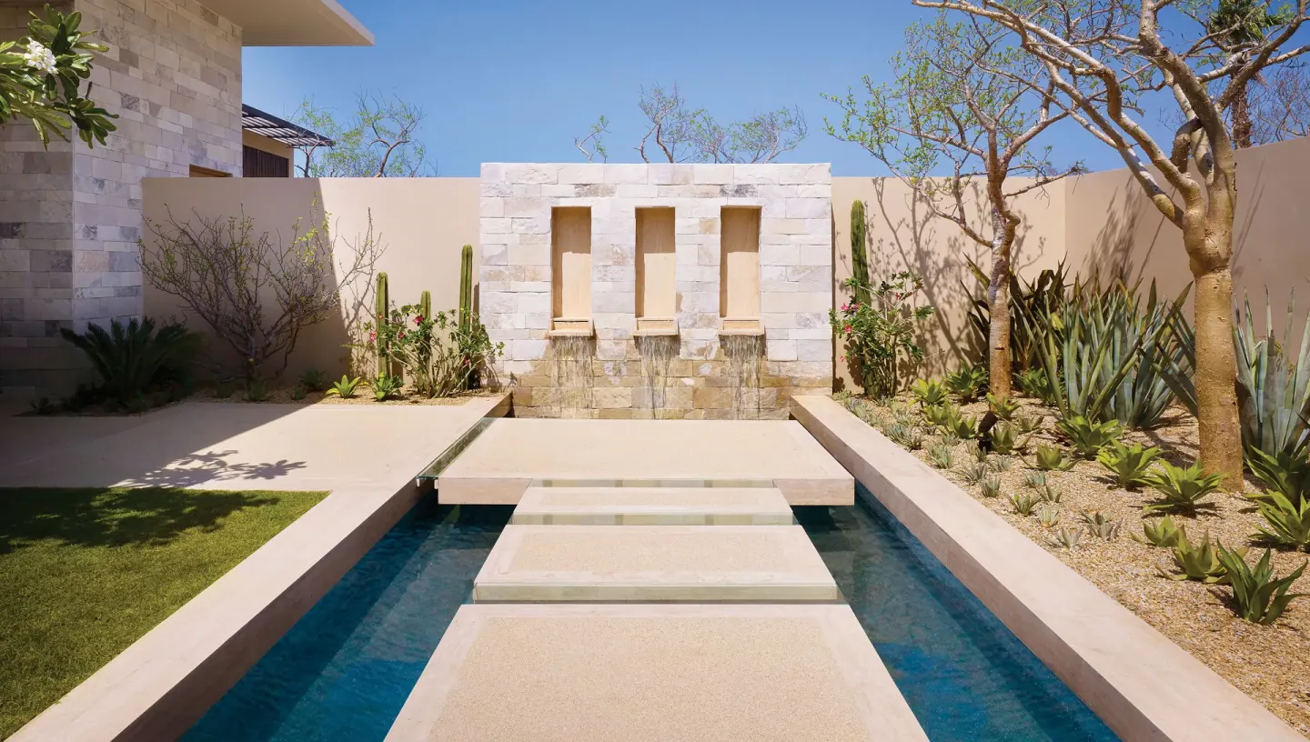 Courtyard reflecting pool and stone water wall at Montage Los Cabos.