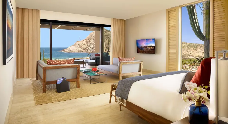 Beach Front Presidential Two Bedroom Suite king bed and ocean sitting area at Montage Los Cabos.