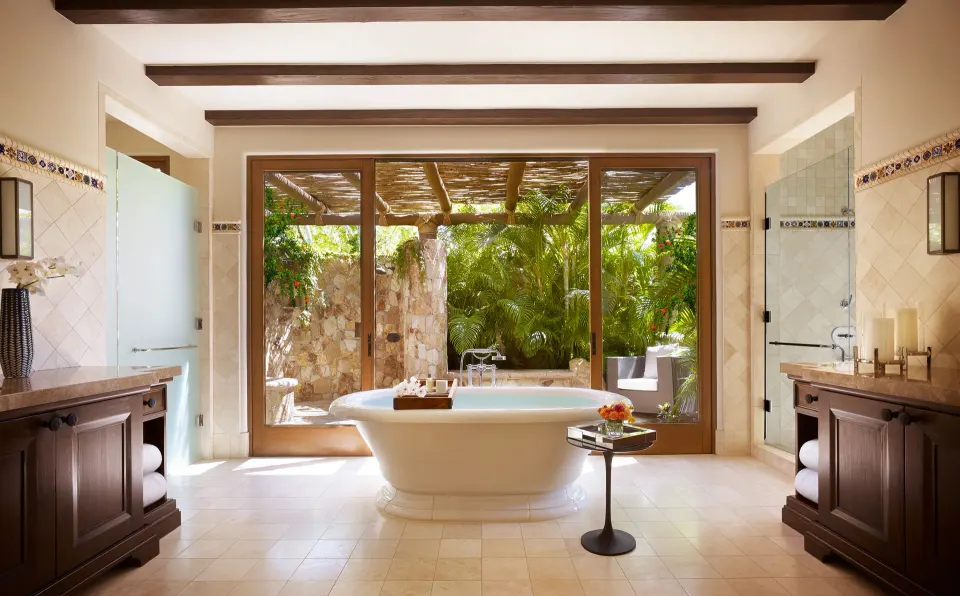 Casa Cardon bathroom with freestanding tub and garden doors at Montage Los Cabos.