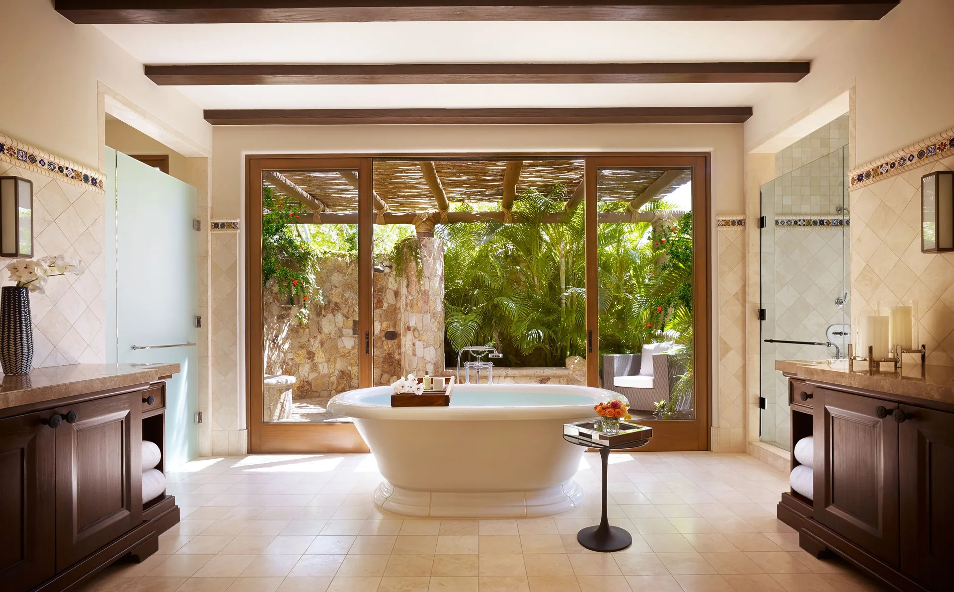 Casa Cardon bathroom with freestanding tub and garden doors at Montage Los Cabos.