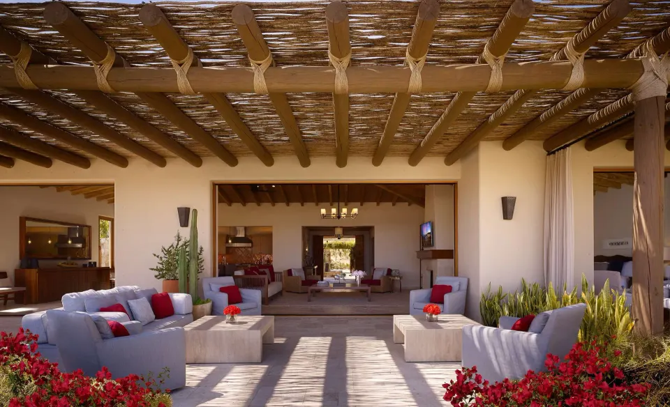 Covered patio lounge at Casa Cardon Five Bedroom Home at Montage Los Cabos opening to the living area.