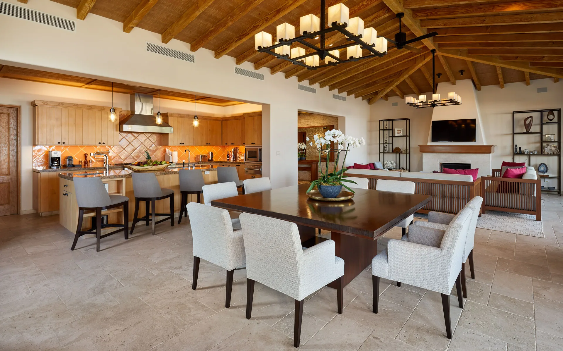 Open kitchen, dining table, and living room in Casa Cardon Five Bedroom Home at Montage Los Cabos.