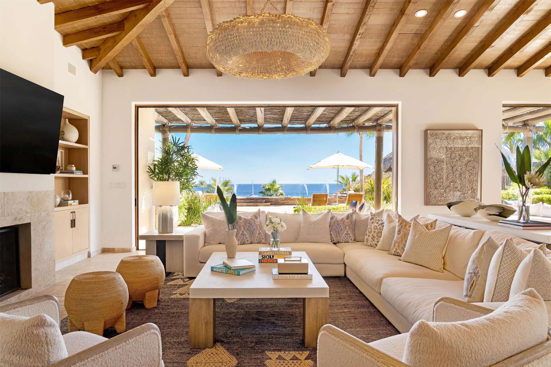 Casa Cardon living room opens to an ocean-view terrace at Montage Los Cabos.