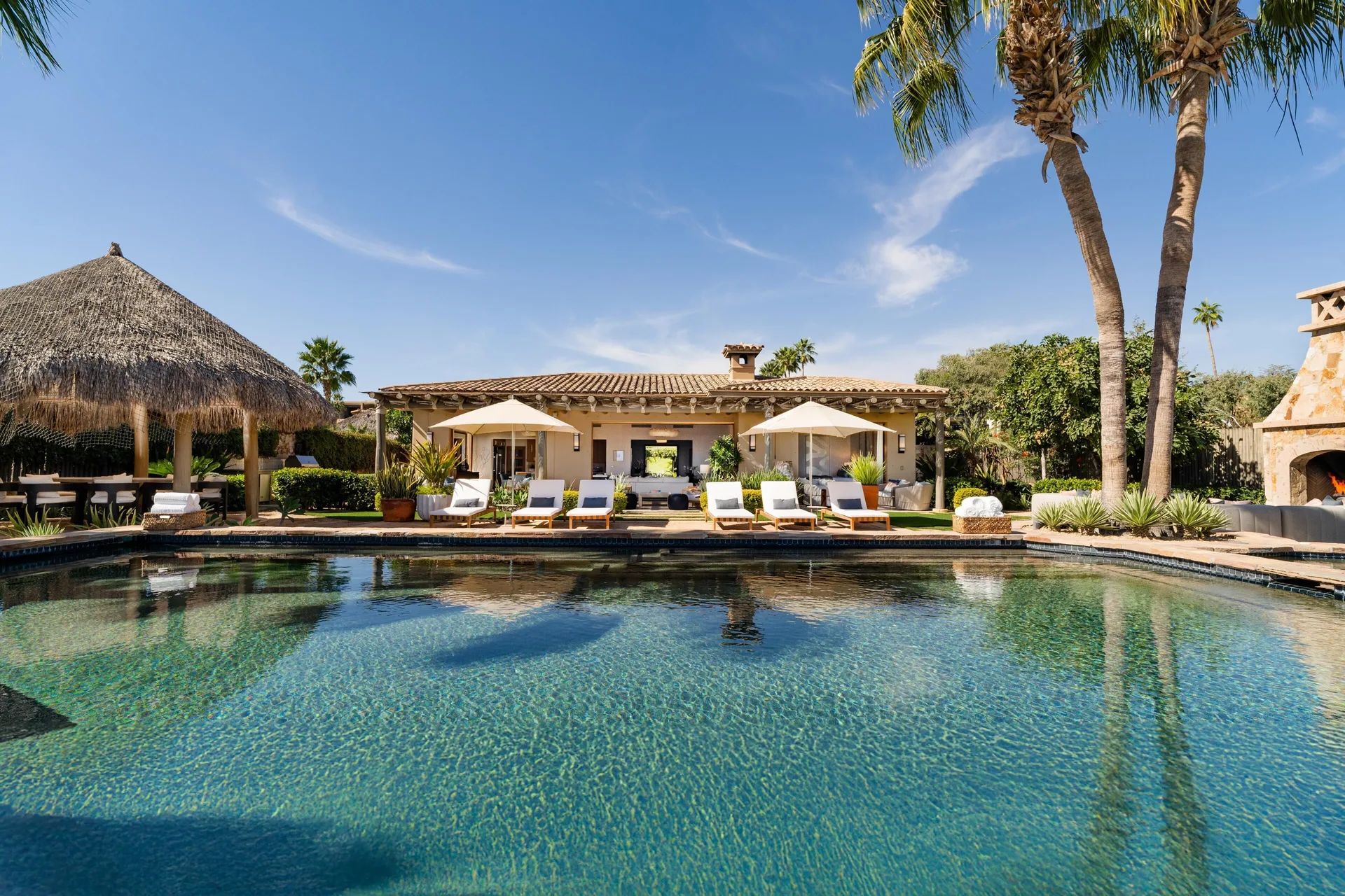 Casa Cardon pool terrace with loungers and palapa at Montage Los Cabos.