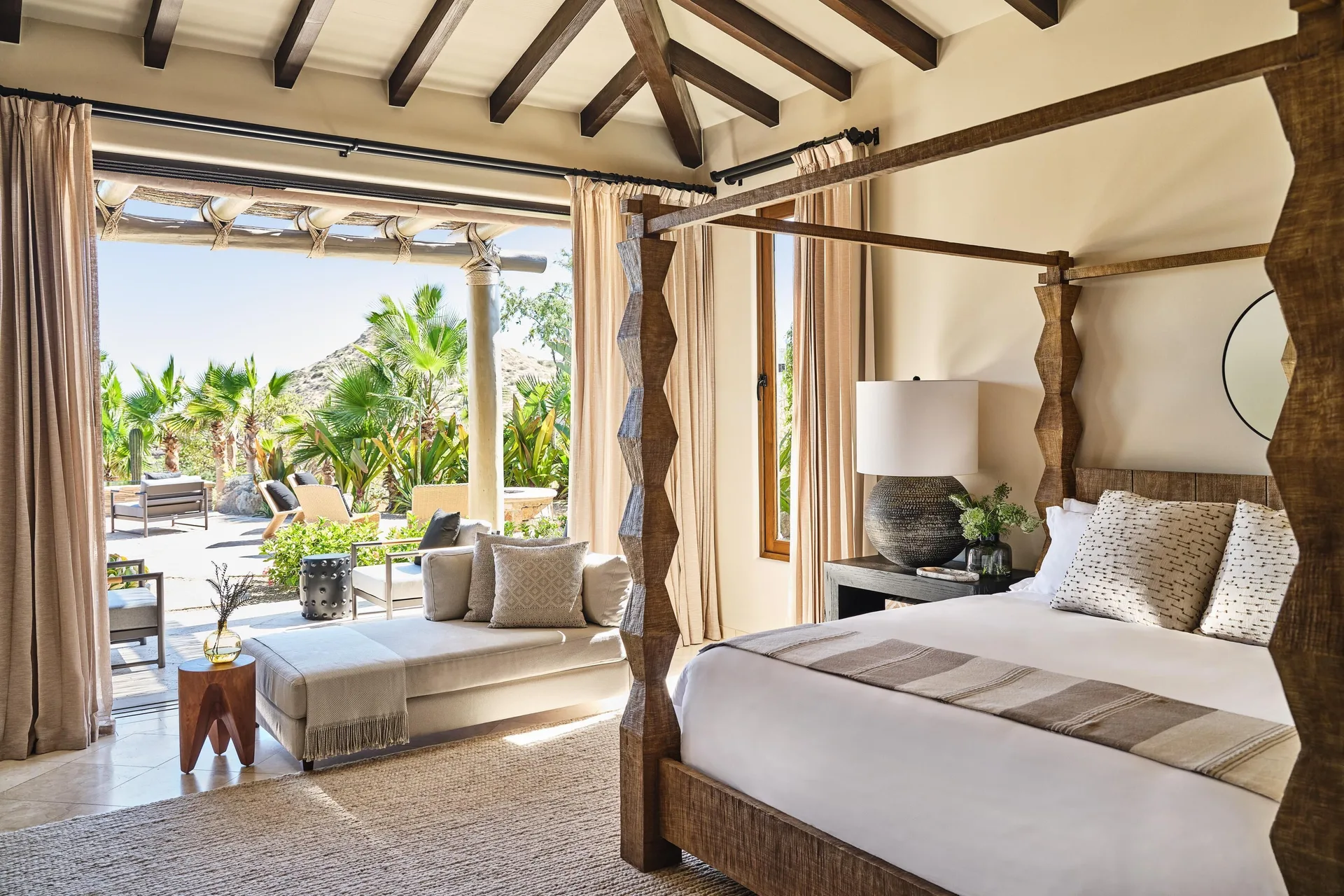 Bedroom in Casa Santa Maria at Montage Los Cabos with a canopy bed and garden terrace.