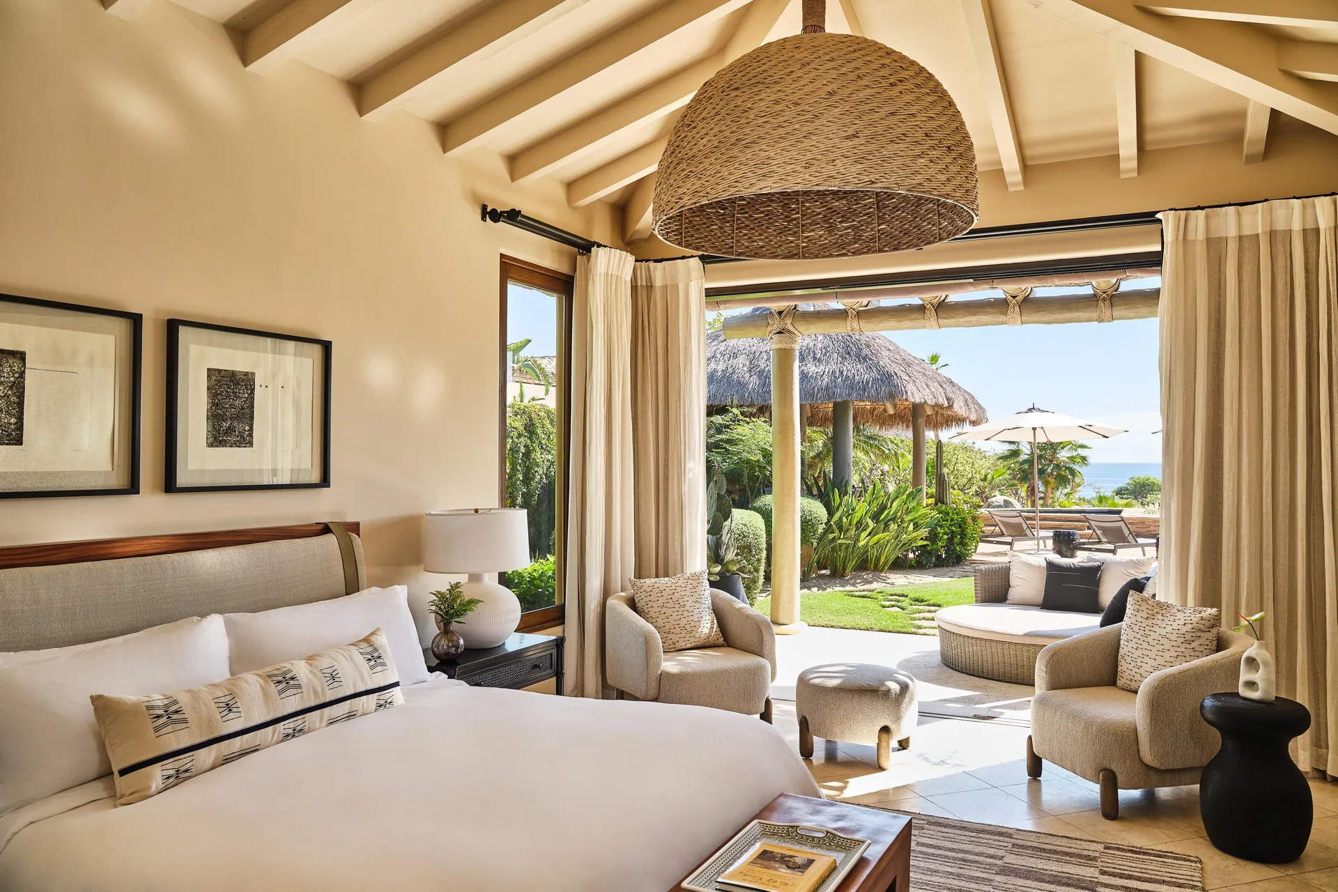 Casa Santa Maria bedroom at Montage Los Cabos with king bed, woven pendant, and garden terrace.
