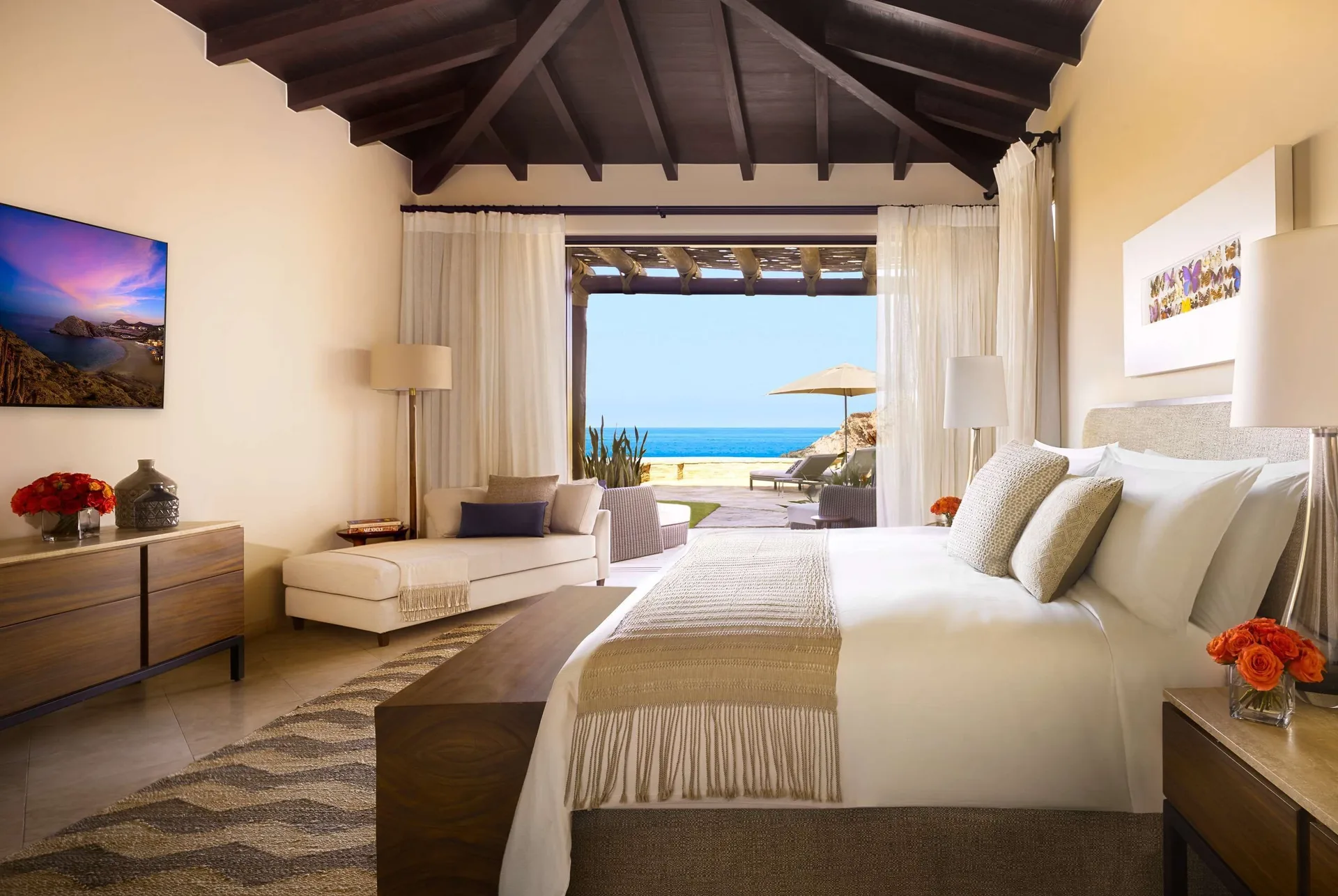 Casa Santa Maria bedroom at Montage Los Cabos with king bed, sitting area, and ocean-facing terrace.