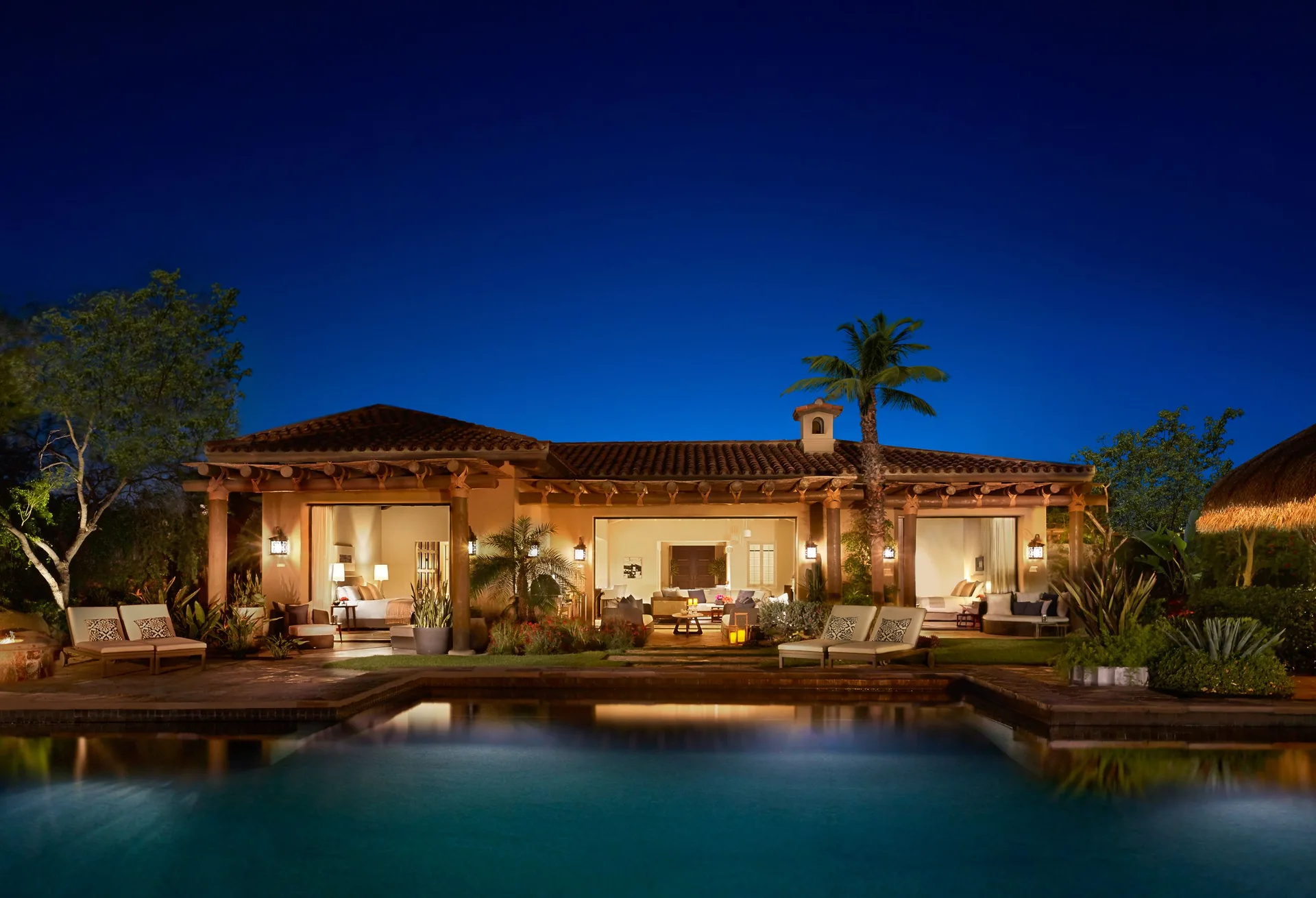 Casa Santa Maria at Montage Los Cabos illuminated at night beside a private pool.